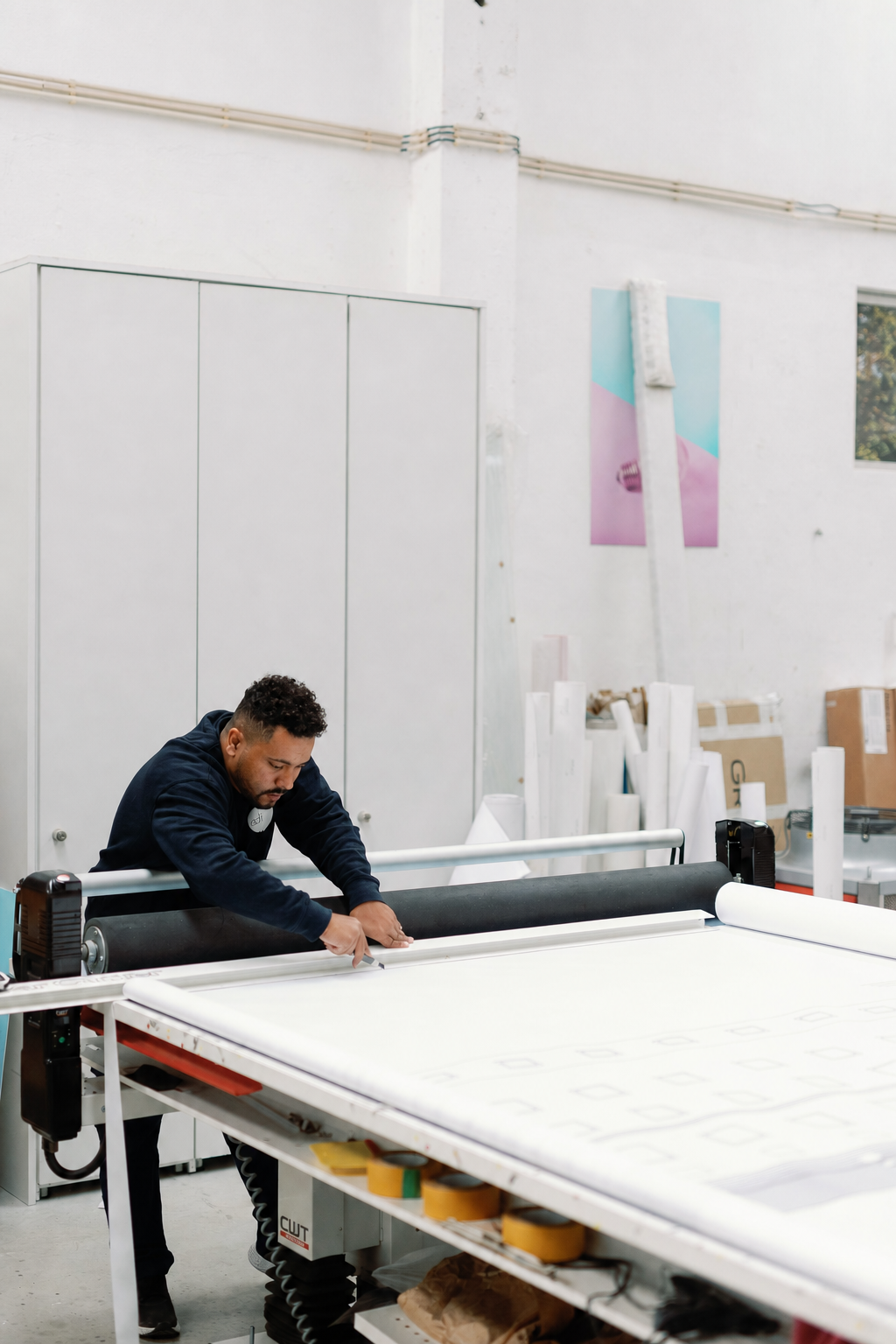 Large-format material being cut on a CWT worktable